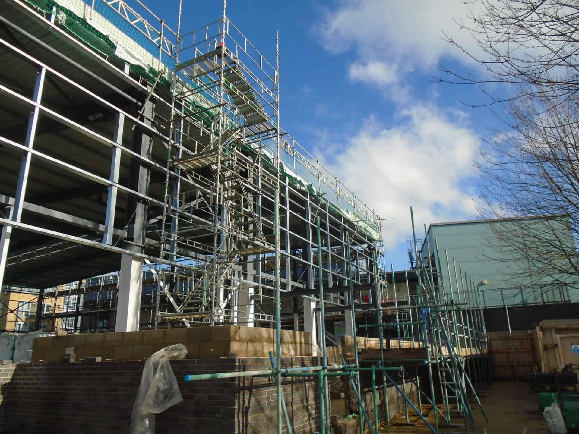 Scaffold and edge protection around a steel-framed building
