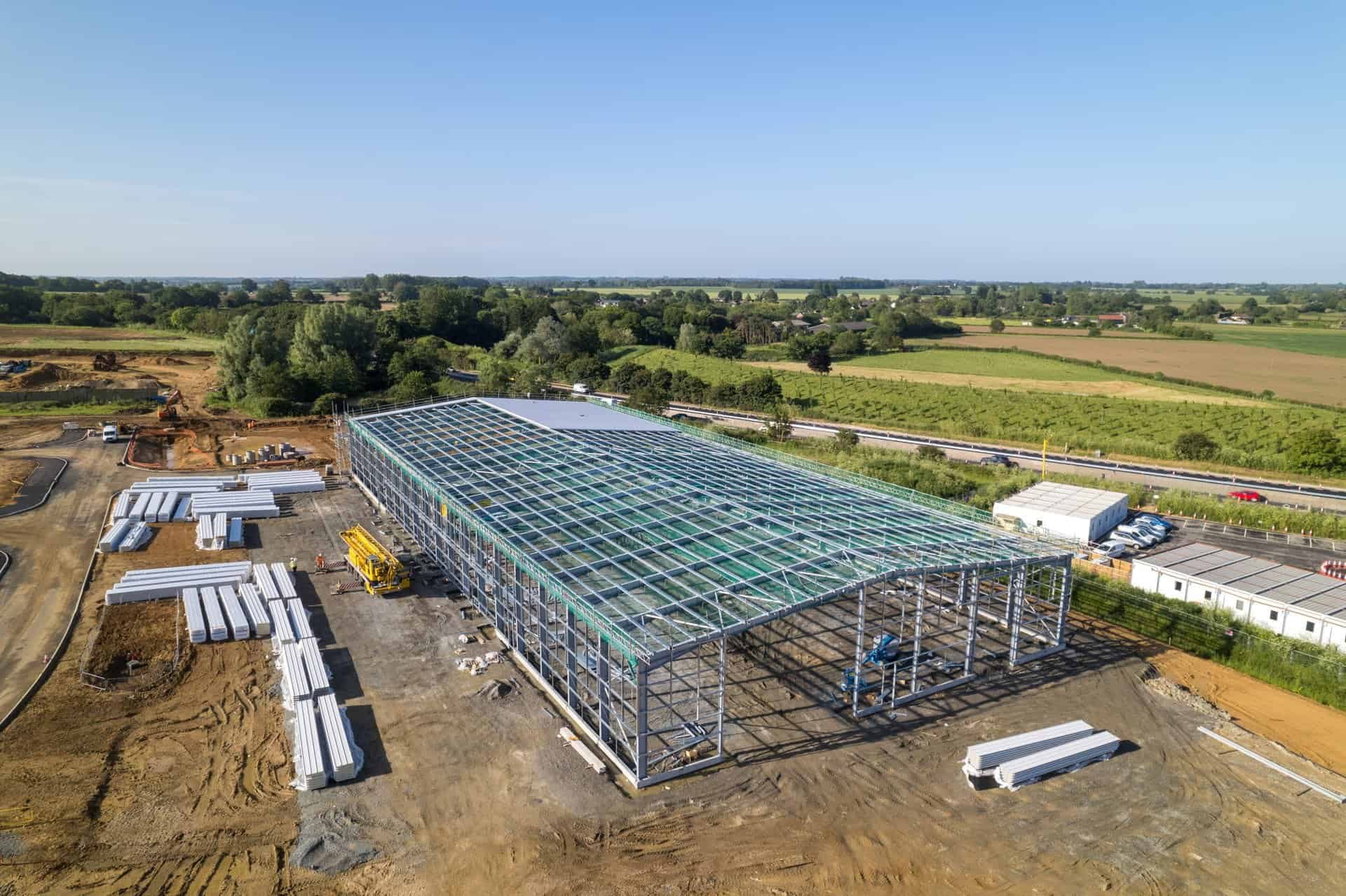 Aerial view of a steel frame with safety netting across the roof